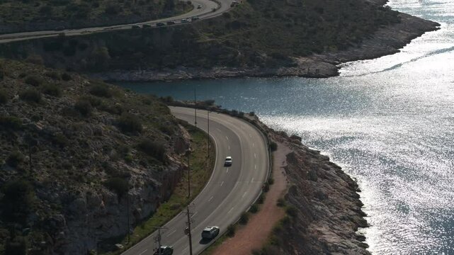 Beachfront road in Southern Athens, Greece with cars - Limanakia Vouliagmeni
