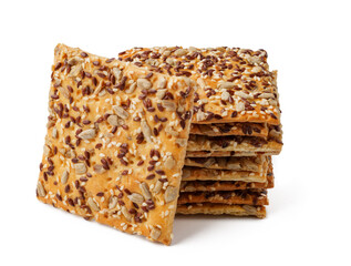 Crunchy seed crackers stacked neatly on a white background ready for a healthy snack option or recipe enhancement