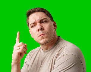 Thoughtful man gestures against a green background