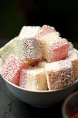 Colorful assortment of traditional sweets arranged in a bowl, perfect for celebrations and gatherings