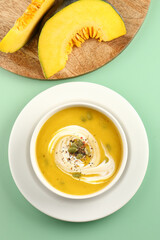Pumpkin traditional soup with creamy silky texture garnished with pumpkin seeds 