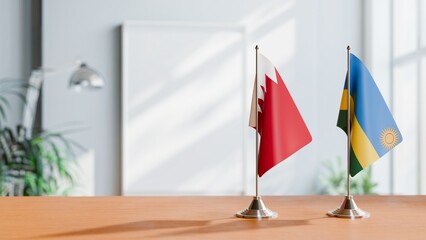 FLAGS OF  BAHRAIN AND RWANDA  ON TABLE