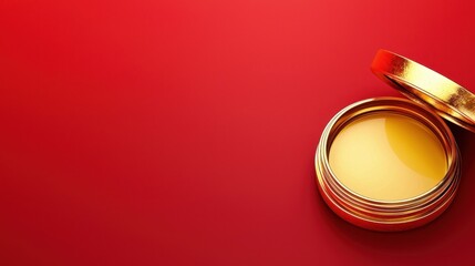 Close-up of an open golden tin can revealing glossy yellow contents, set against a vibrant red background for a striking visual effect.