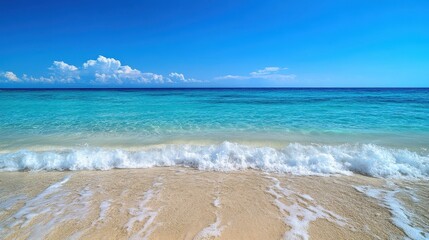 Close-up of smooth ocean waves with a clear blue sky and a peaceful atmosphere