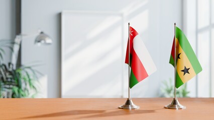 FLAGS OF OMAN AND SAO TOME ON TABLE
