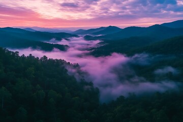 Drone view of a sea of clouds over a mountain range at sunrise 