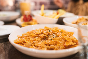 Spicy Chicken Cheese Tomato Bolognese Pasta Farfalle photo for use on menus and Italian restaurant websites