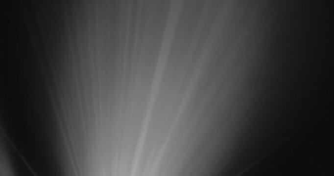 Lasershow with Multiple Laser Beams in Fog, The concepts of performance arts, Colored light beams from reflector through the foggy night sky