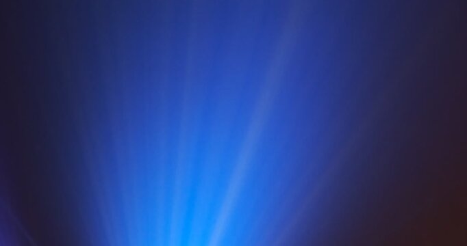 Lasershow with Multiple Laser Beams in Fog, The concepts of performance arts, Colored light beams from reflector through the foggy night sky