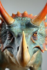 A detailed close-up of a colorful triceratops figure showcasing its textured skin and features.