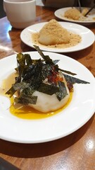 Tasty rice mochi ball with Roasted seaweed and peanut sugar powder, Chewy and flavorful snacks, sweet dessert, traditional Asian food, Japanese,Taiwanese food