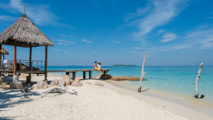 Enjoying paradise on Koh Munnork Island in Rayong, Thailand with white sandy beaches and blue skies