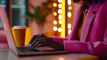 Woman in Pink Jacket Typing on Laptop Computer