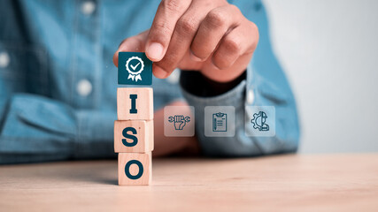ISO quality control certification concept. wooden cubes with the abbreviation ISO with a check mark.