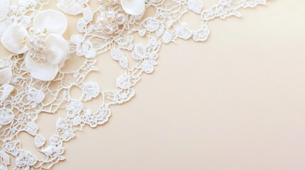 Delicate white lace and pearl flowers on beige background