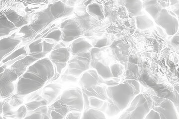 Obraz premium Abstract grayscale image of water surface with light reflections.