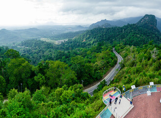 Aerial drone view of  mountain viewpoint surrounded with greenery rainforest at Wang Kelian, Perlis, Malaysia.