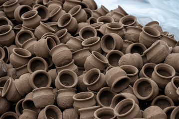 Hands of a potter at work. Potter making ceramic mug on the pottery wheel