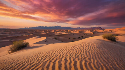 A colorful sunset in the desert, with dramatic clouds glowing in shades of magenta and peach, and sand dunes reflecting soft pastel colors.