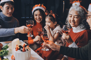 Happy multigeneration family enjoying in opening gifts on Christmas eve at home.
