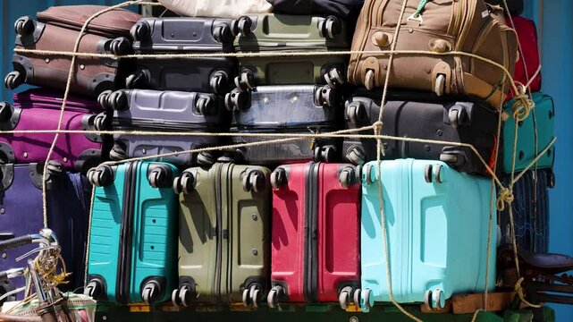 Luggage Trolleys Piled on Rickshaw Cart During Day