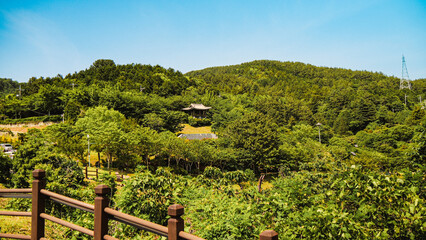 Jeongyang-dong, Tongyeong-si, Gyeongsangnam-do, South Korea  Winter and side view of bronze statue of Admiral Yi on the hill of Yi Sun-sin Park against sea Sea and nature landscape in Tongyeong Yi Sun