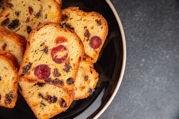 Fruit cake dessert sweet dried fruit traditional pastry, nuts meal food snack on the table copy space food background rustic top view