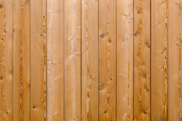 Fototapeta premium wooden flooring made of pine boards, details are arranged vertically. background for design