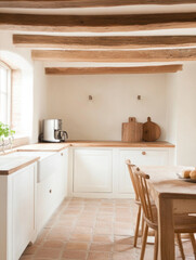 cozy kitchen with wooden beams, white cabinets, and rustic table