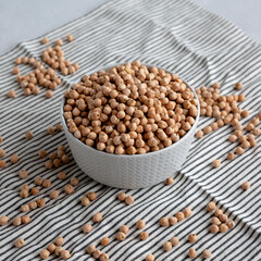 Dry Organic Chickpeas in a Bowl, side view.