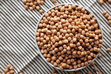 Dry Organic Chickpeas in a Bowl, top view. Flat lay. overhead, from above.