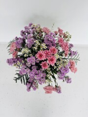 Floral arrangement with pink, purple and white tones for a new year to celebrate luck, prosperity and a good fortune