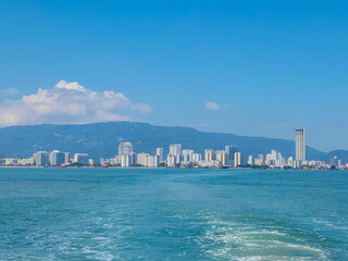 Naklejka premium Daytime of Penang cityscape taken from the ferry. Beautiful cityscape of Malaysia.