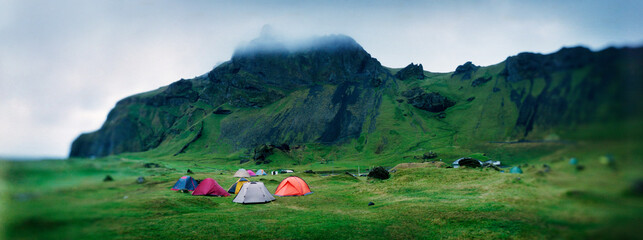 Panoramic view of tents camping in Herjólfsdalur valley on Heimaey island, Westman islands, Iceland, Scandinavia, Europe..