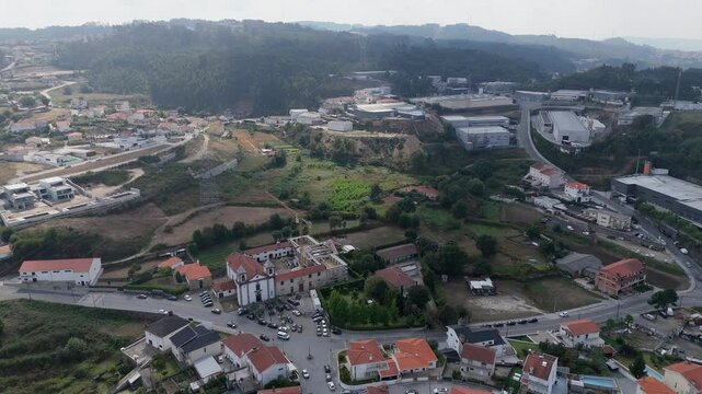 Aerial - Igreja Paroquial de Santo Est&ecirc;v&atilde;o de Vilela with rural surroundings, Paredes, Portugal