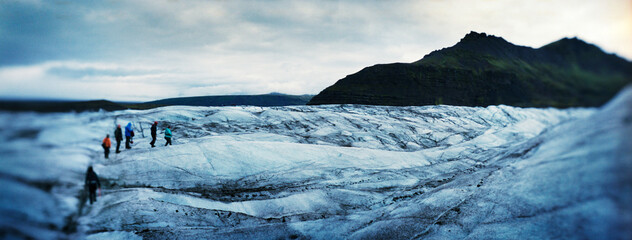 Panoramic view of hikers walking the glaciers of Skaftafell national park, Vatnajökull, Southeast Iceland, Scandinavia, Europe.