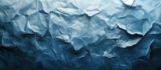 Obraz premium Crumpled wrinkled and wavy abstract background texture made of blue and gray crushed rumpled and scrunched paper Grunge vintage and distressed style digital art material with an uneven