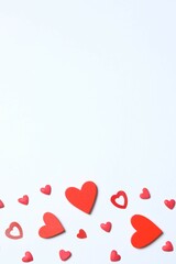 Beautiful red paper hearts on white background