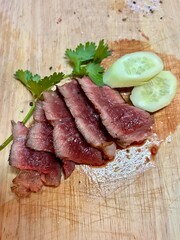 Steak made from Ponyangkham beef, Sakon Nakhon, grilled and cut into medium rare pieces.