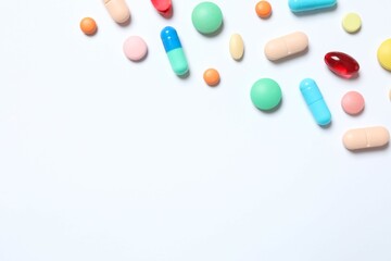 Various pills on white background