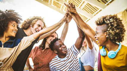 Community of young people stacking hands together - Multiracial college students putting their hands on top of each other - Human relationship, social, community and college concept