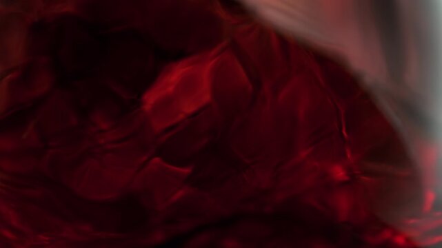 Super Slow Motion Macro Shot of Spinning Red Wine in Glass at 1000fps.