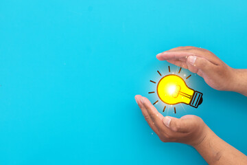 Light bulb in hand symbolizing new ideas, creative solutions, and innovative thinking for business strategy,imaginative thinking.