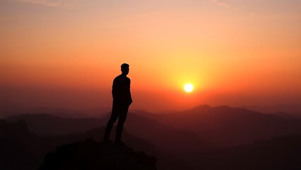 Obraz premium silhouette of person standing on top of mountain