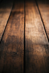 A detailed macro shot of a wooden table board, highlighting the fine texture and natural imperfections of the wood surface 