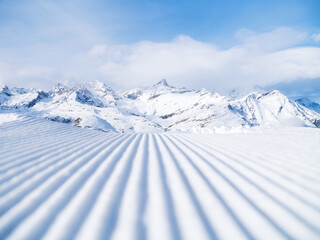 Snow slope for skiing and snowboarding. Velvet. Winter sports. Slope and mountains. Composition in...