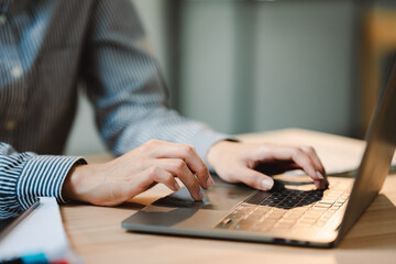 Typing on keyboard Working online on laptop computer On a white table at the office. Facebook chat. Web meeting. Blogger. Journalist writing an article. online job ideas