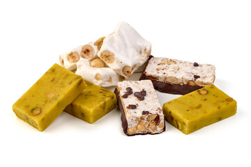 Assorted nougat bars with hazelnuts and chocolate, isolated on white background.