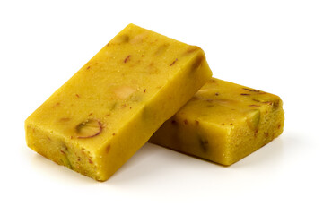 Saffron nougat bar with almonds and pistachios, isolated on white background.