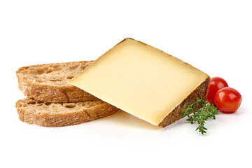 Rustic cheese wedge with artisan bread slices, cherry tomatoes, and fresh thyme, isolated on white background.